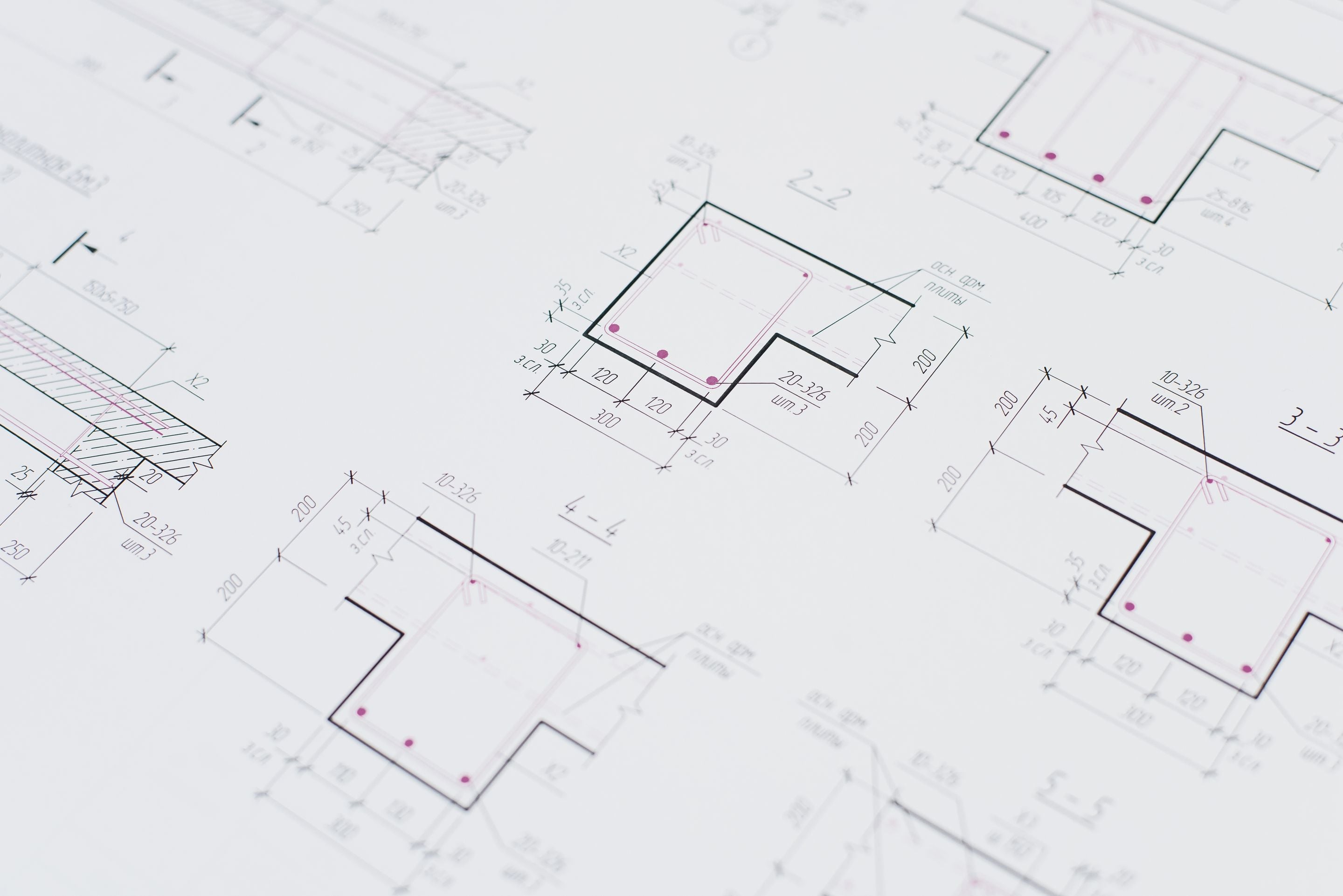 Architectural blueprint with room outlines and dimension lines on white paper
